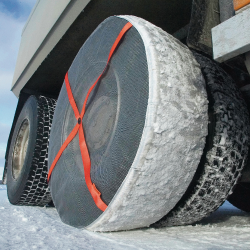 Close-up of AutoSock textile traction device mounted on truck wheels