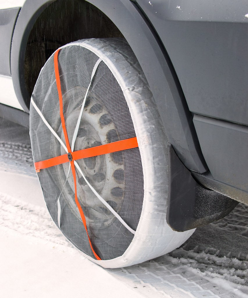 Close-Up of mounted AutoSock on rear wheels of a transporter van